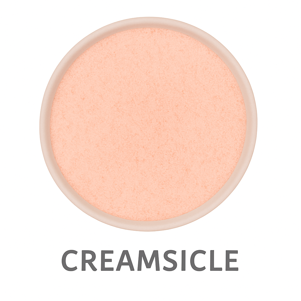 A round container holds peach-colored powder labeled "Creamsicle Flavored Cotton Candy Sugar" in bold gray letters underneath.